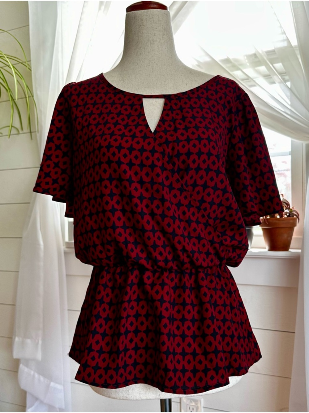 West Kei Debbi Surplice Peplum Blouse. Red/black geometric pattern. NWT
Size: S